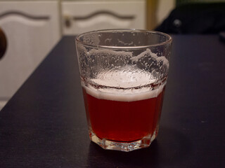 glass of fruit beer on table