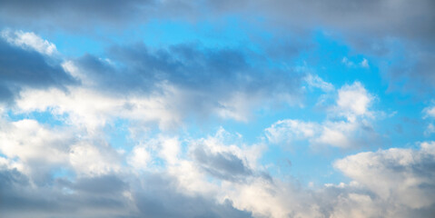 Beautiful tender sunrise sky with clouds. Sky background.