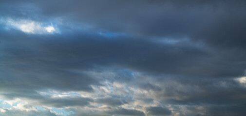 Sunset sky background. Beautiful bright sunset sky with clouds.