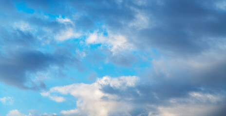 Beautiful tender sunrise sky with clouds. Sky background.