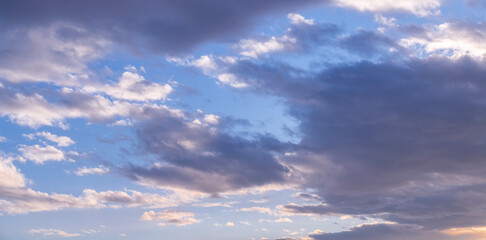 Beautiful tender sunrise sky with clouds. Sky background.