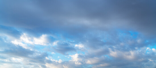 Sunset sky background. Beautiful bright sunset sky with clouds.