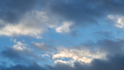 Beautiful tender sunrise sky with clouds. Sky background.