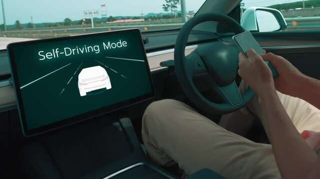 Self driving car or autonomous vehicle travel on speed highway with driverless system and autopilot mode allowing man driver relax and focus on smartphone without compromising safety. Fastidious