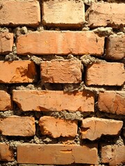 red brick masonry. antique brick wall vertical background, ancient red brick masonry surface