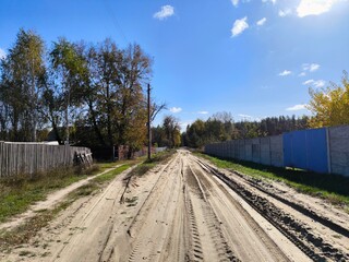 Fototapeta premium railway in the countryside. Beautiful rural autumn road