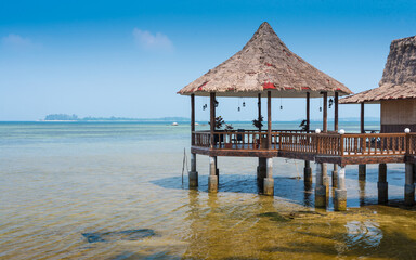 Relaxing gazebo built in the ocean water on a beach in Jamaica