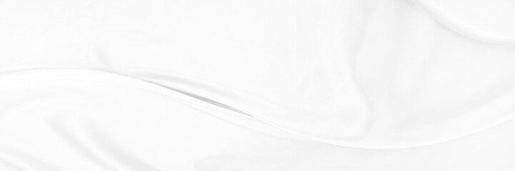 White gray satin texture that is white silver fabric silk panorama background with beautiful soft blur pattern natural.