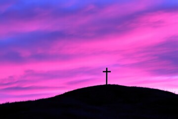 Obraz premium Sunset Silhouette of Cross on Hill Against Vibrant Pink Sky