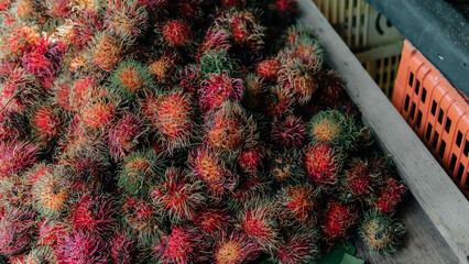 A vibrant and colorful pile of rambutans, showcasing their unique and spiky appearance in rich colors