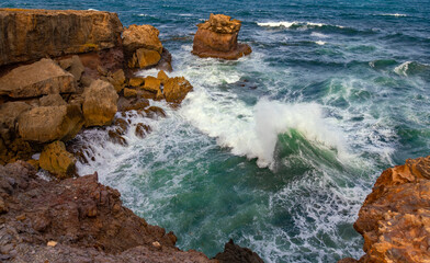 “La pointe d’Enfer“ panorama with steep cliff on the Atlantic coast in the south of Martinique, France. Waves breaking on wild rocky coast of caribbean island and tropical tourist destination.