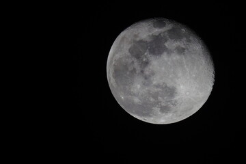 Full moon in black night sky. 
