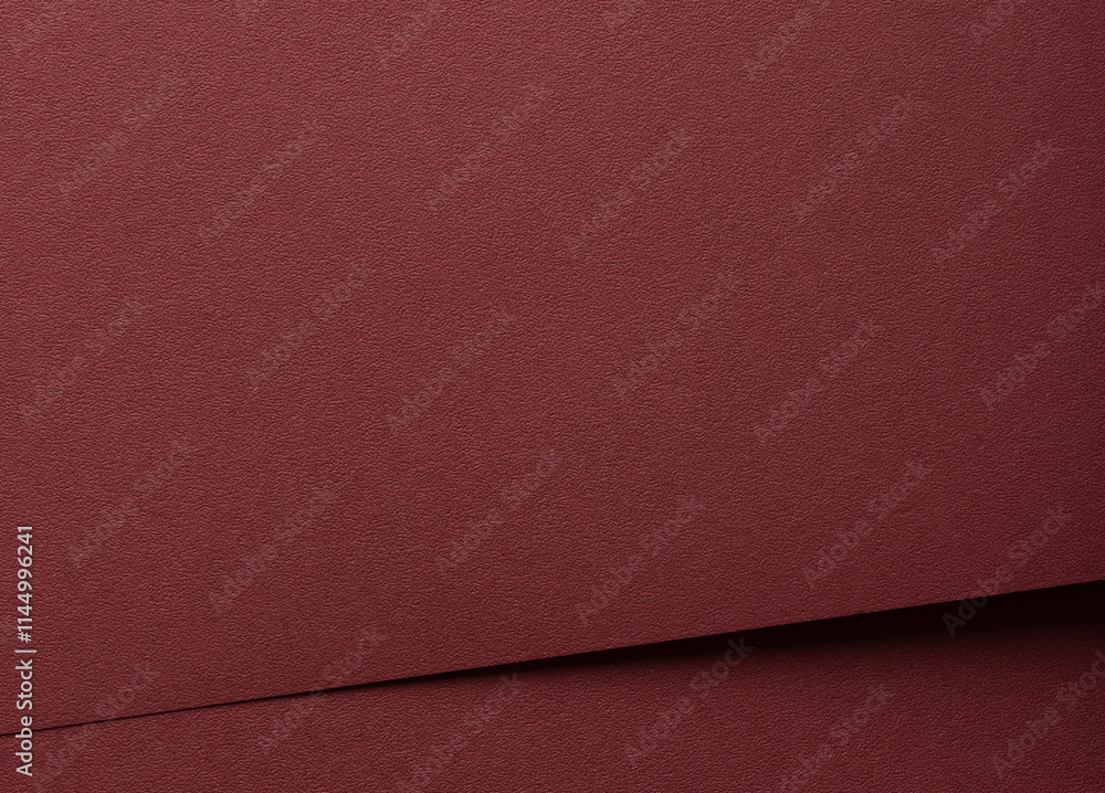 Poster paper texture in deep marsala tone. Elegant, grainy surface with a matte finish, featuring reddish brown hues and brick red details. Perfect for premium design, wrapping, or luxury