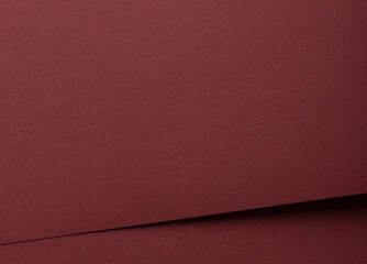 paper texture in deep marsala tone. Elegant, grainy surface with a matte finish, featuring reddish...