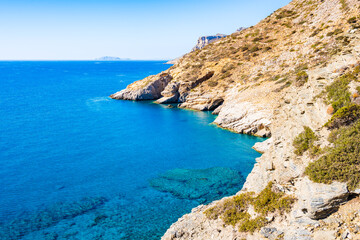 Fototapeta premium View of Mouros bay with azure blue sea and high cliffs, Amorgos island, Cyclades, Greece