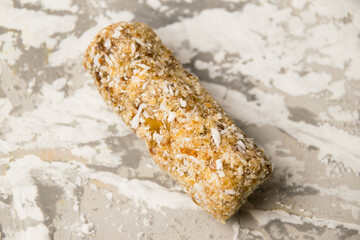 Delicious homemade energy bar without sugar on light background. Diet and healthy eating concept