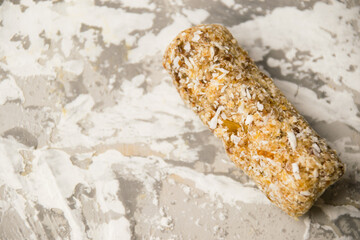 Delicious homemade energy bar without sugar on light background. Diet and healthy eating concept