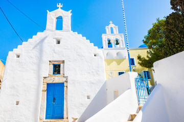 White facade of church with blue door in Lagada village, Amorgos island, Cyclades, Greece