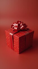 Fototapeta premium Elegant Red Gift Box With Ribbon On Red Background