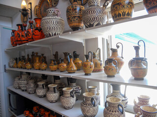 Traditional pottery displayed in a vibrant shop