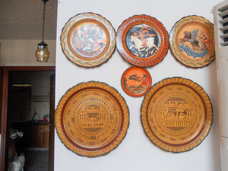 Colorful decorative plates arranged on a wall