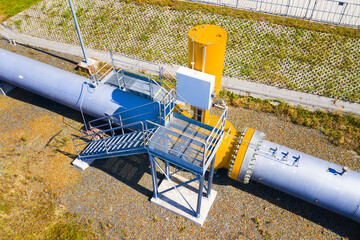 Natural gas pipeline in European Union. High pressure pipes on a hot summer day.