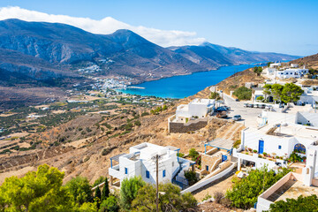 View of Tholaria village with Aigiali sea bay and mountains in distance, Amorgos island, Cyclades,...