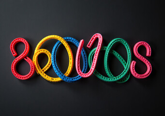 colorful rubber bands black background convey ideas