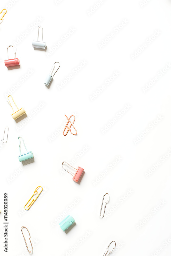 Aufkleber a set of colorful paper clips arranged on a white background to convey business creativity and flat 