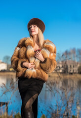 Slavic retro aesthetic. Portrait of a European type Blond head Young woman with natural skin in fur...