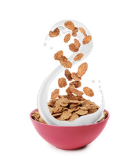 Crunchy cereal falling into bowl with milk splashes isolated on white background