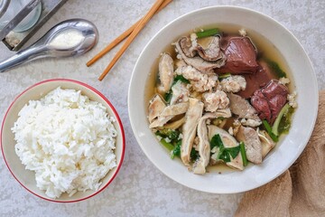 Thai Style breakfast Clear Soup with Congealed pork blood and  steamed rice. Thai Traditional boiled soup pig blood supply, top view	