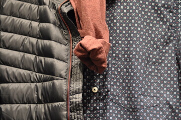 Presentation of men's shirts, pullovers and winter jackets in blue