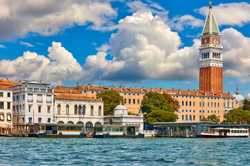 Venice, Italy. Saint Mark's Square view from the water. Famous tower (Campanile) on background of...
