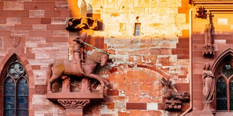 Detail, Saint George, dragon slayer and martyr on the facade. Basel Minster. Basel, Canton...