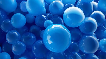 A vibrant collection of glossy blue spheres in various sizes, creating a dynamic and visually appealing abstract composition.