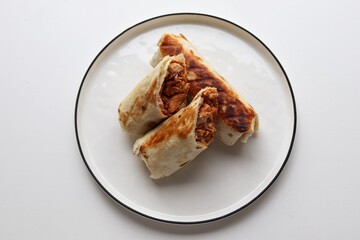 Photography of homemade plated meals. Ranging from rice dishes to wraps to chicken to pasta.