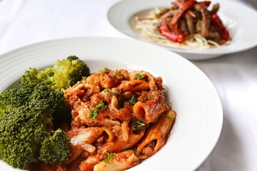 Photography of homemade plated meals. Ranging from rice dishes to wraps to chicken to pasta.