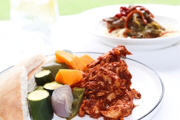 Photography of homemade plated meals. Ranging from rice dishes to wraps to chicken to pasta.