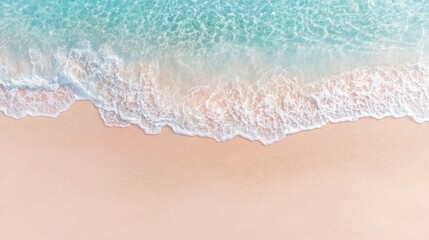 Abstract sand beach from above with light blue water wave. Summer vacation background banner with copy space.