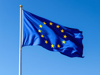 European Union flag waving against a clear blue sky with scattered clouds.