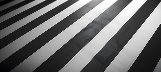 Obraz premium A modern abstract background in bold white and black tones with sleek diagonal lines creating a geometric visual impact.