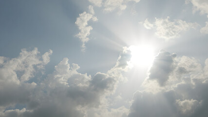 gradient sky background with clouds and sun rays