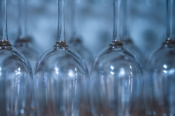Upside down wine glasses at a restaurant.