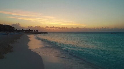 Fototapeta premium Serene Beach Sunset Over Calm Ocean Waves with Soft Clouds and Tranquil Atmosphere, Ideal for Relaxation and Vacation Imagery