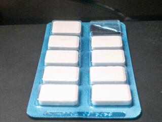 A pack of chewing gum with a blue background, showcasing the freshness and convenience of on-the-go snacking.