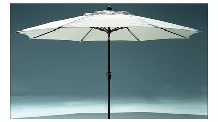A white umbrella is standing in front of a blue sky