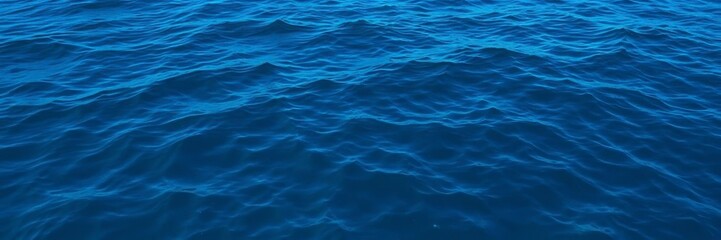 Obraz premium Dark blue ocean water with rippling texture, creating a mesmerizing deep sea pattern, aquatic, background