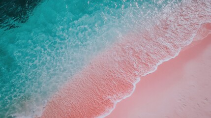 Fototapeta premium Beautiful pink sand beach blends with sparkling blue waves during a sunny day