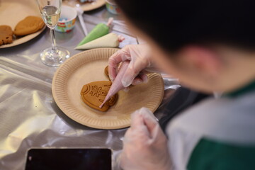 Engaging in a Creative Cookie Decorating Activity with Friends for Fun and Enjoyment